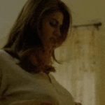 Alexandra Daddario fully nude on a guy’s lap & getting licked from behind