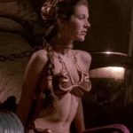 Carrie Fisher as slave Leia tightening her abs