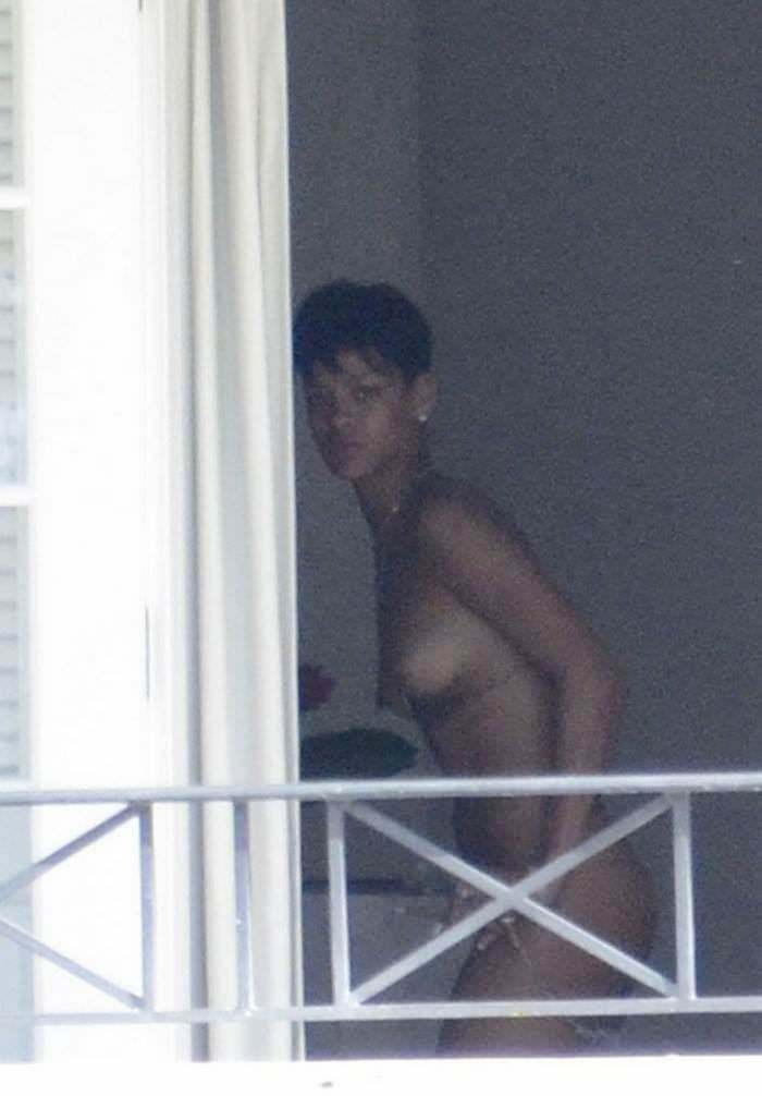 Rihanna fully naked by the window