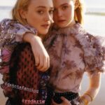 See through top on Elle Fanning as she poses with Dakota Fanning