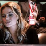 Owner’s wife in the luxury box, figuring out which player to bring home tonight... [Margot Robbie]