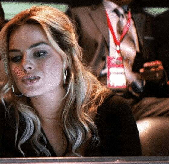 Owner’s wife in the luxury box, figuring out which player to bring home tonight... [Margot Robbie]