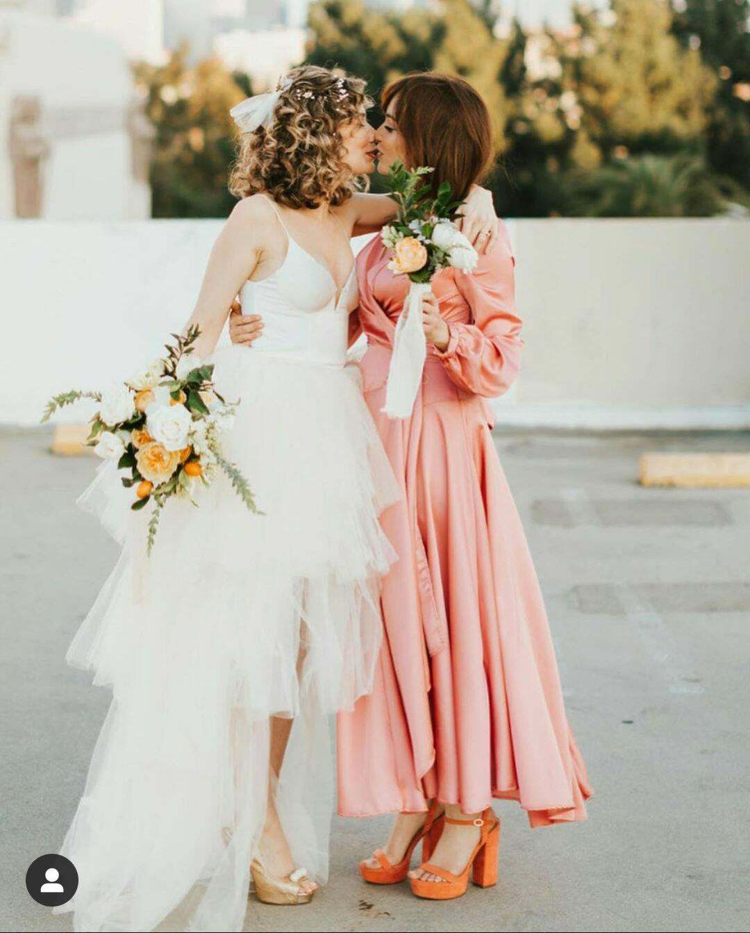 Milana Vayntrub as a bridesmaid