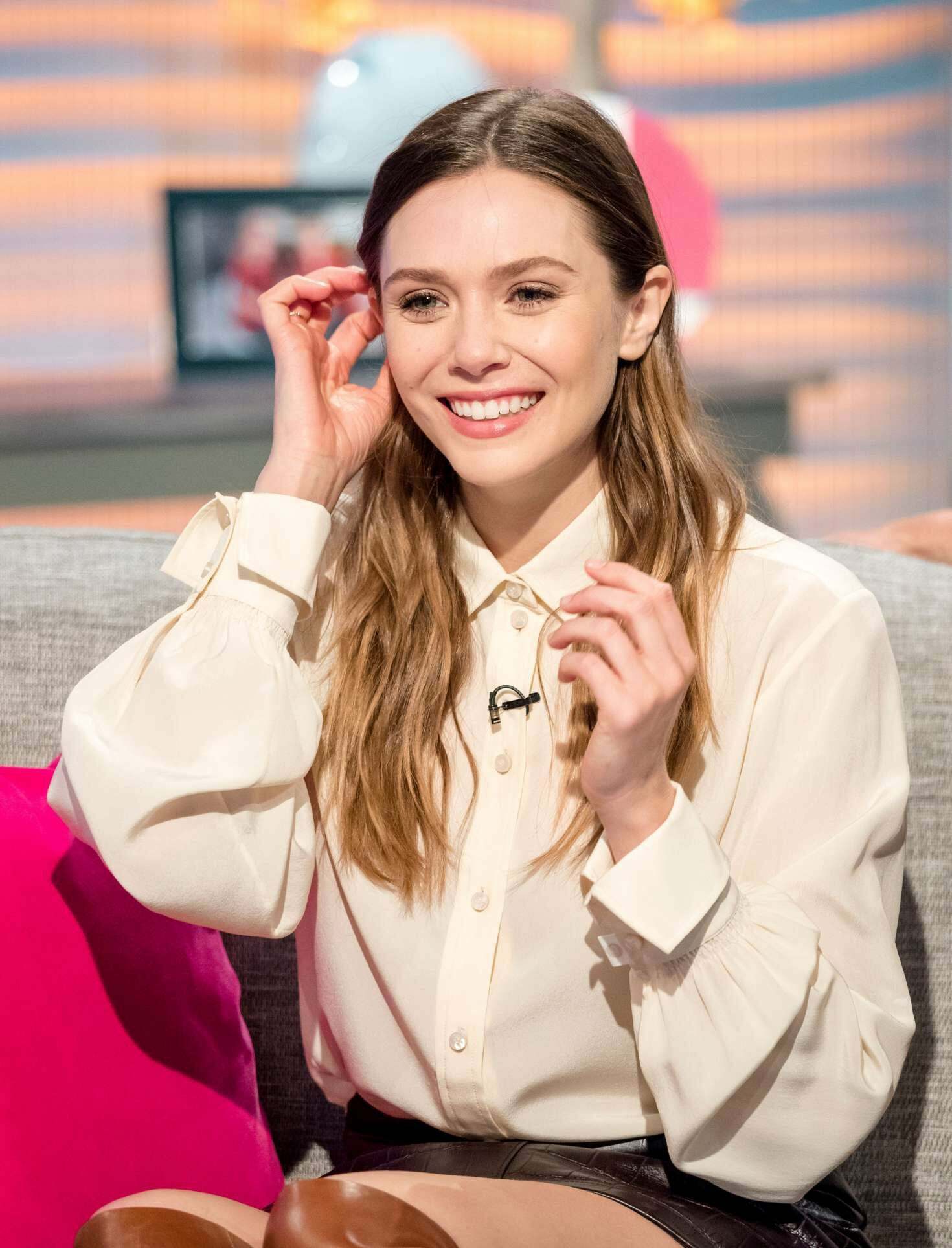 Love how much Elizabeth Olsen wears blouses with likely no