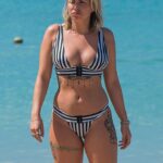 Olivia Buckland Hits The Beach In A Black And White Bikini (57 Photos + Video)