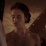 Lily James bent over in the exception