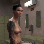 Ruby Rose showing off her tattoos.