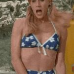 Amy Adams trying to cover her modesty in 'Psycho Beach Party' (2000)