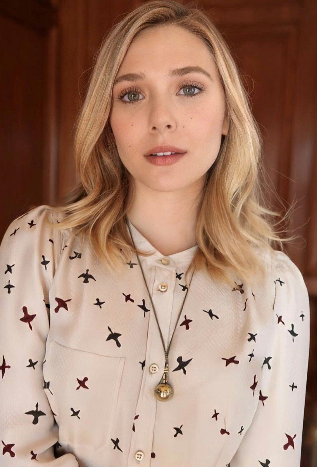 No need to act so innocent and proper, Elizabeth Olsen. We all know that you're a horny little girl in need of cock.