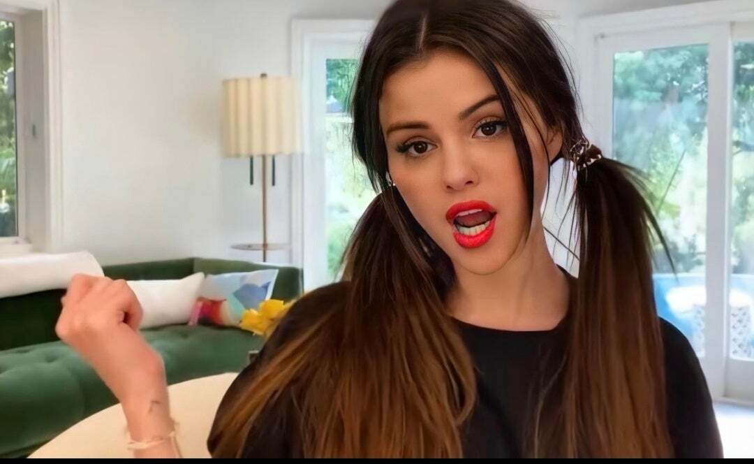 This has to be her best look so far. That red lipstick and those ponytails just make my knees weak 🍆💦 | Selena Gomez