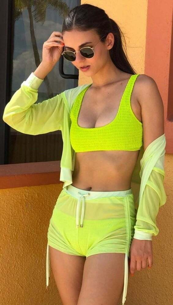 Victoria Justice in a yellow...or is it some kind of green?...bikini