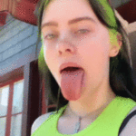 Billie Eilish showing of her long tongue