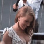 Scarlett Johansson's tits almost pulling out of her dress