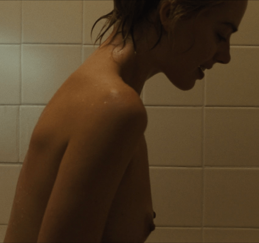 Margot Robbie smiling while exposing her beautiful nipples