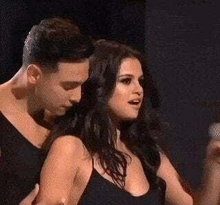 Just look at the dancer's face , even he is having a super tough time resisting Selena Gomez.