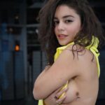 Vanessa Hudgens shows off her sunflower tattoo and flashes sideboob