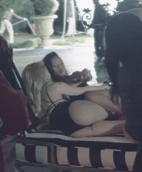 Rihanna grabbing a handful of Shakira‘s ass