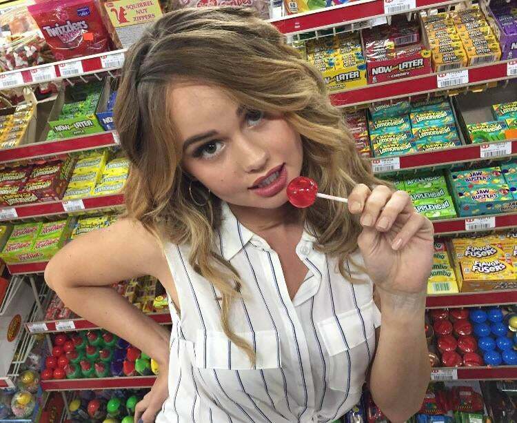 Debby Ryan knows what you're thinking when she licks her lollipop