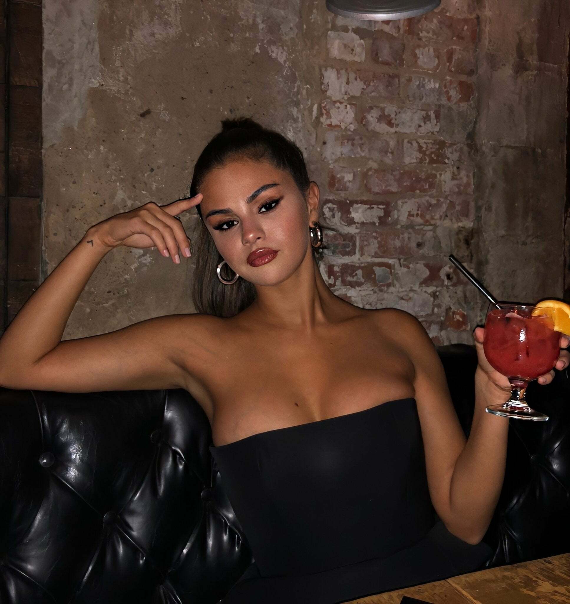 Selena Gomez's Boobs about to burst out that top