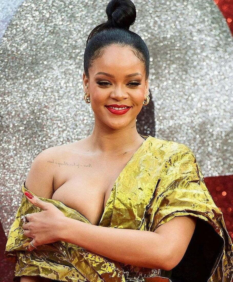 Rihanna just loves to show off her big round breasts!