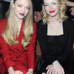 Amanda Seyfried and Emma Stone. Both naked, laying next to you. You can fuck them both however you like, but have to cum inside one of them. Who are you cumming in, and where?