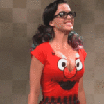 Katy perry's breasts are so big that her top can't hold them.