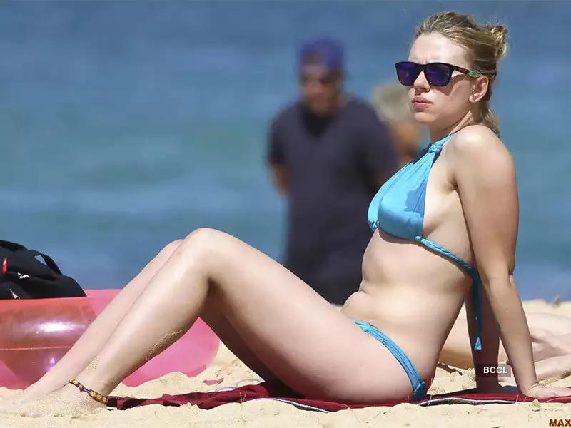 Scarlett Johansson is lying on the beach, ready to take care of the seed of random men in her fertile pussy...