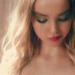 Dove Cameron groping her tits in her MV