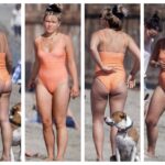 Can't get enough of Florence Pugh in this orange one piece