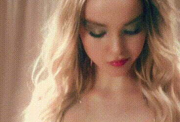 Dove Cameron groping her tits in her MV