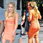 Prime Hilary Duff in a tight orange dress