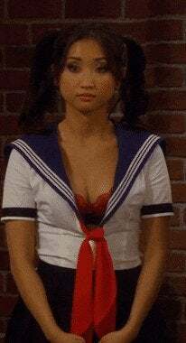 Brenda Song's cleavage on display in a schoolgirl outfit