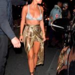 The goddess Kourtney Kardashian going out in nothing but a sparkly silver bra and a golden skirt