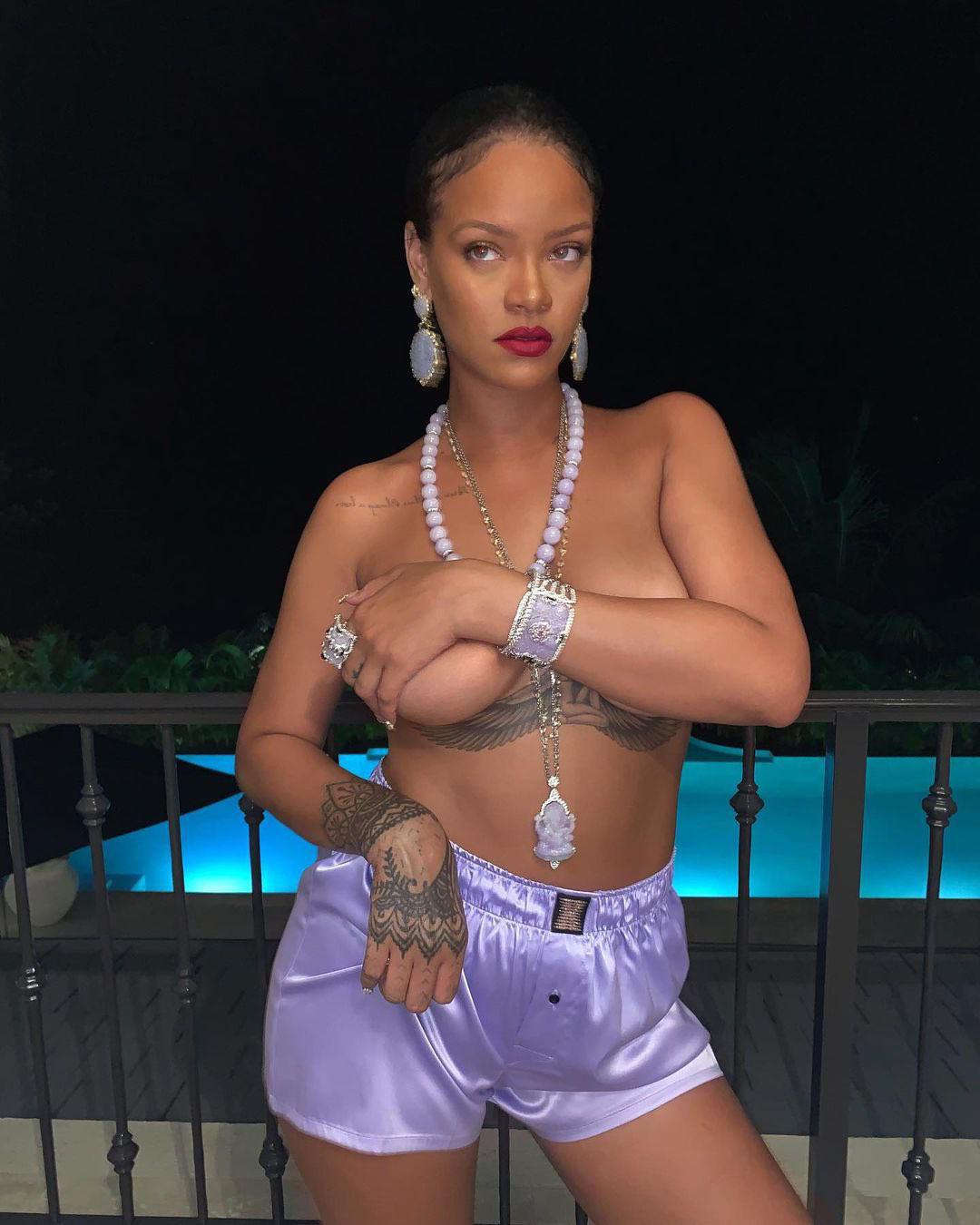 Rihanna covering her big fat titties