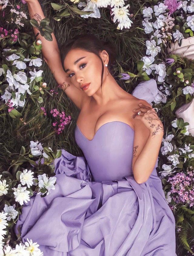 Ariana Grandes beauty matches tie flowers she lays with