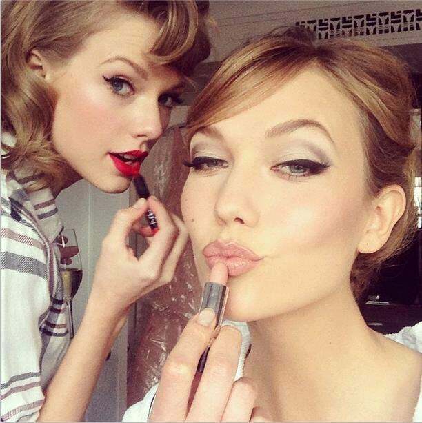 Taylor Swift and Karlie Kloss getting ready to kiss