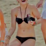 2007 Hilary Duff on her knees in a tiny black bikini