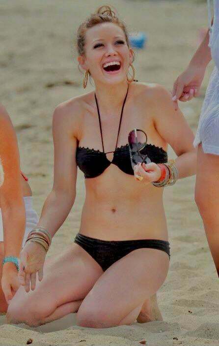 2007 Hilary Duff on her knees in a tiny black bikini