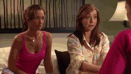 Alyson Hannigan and Emily Deschanel in Tit for Tat tongue