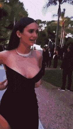 Nina Dobrevs tits nearly spilling out of her elegant dress