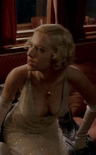 Scarlett Johansson standing up in low cut dress