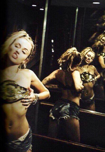 Miley Cyrus with WWE belt