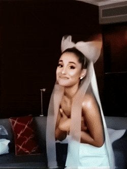 Ariana holding her barely there itty bitty titties