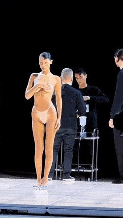 Bella Hadid Gets Dress Spray Painted Onto Her Mid Fashion Show
