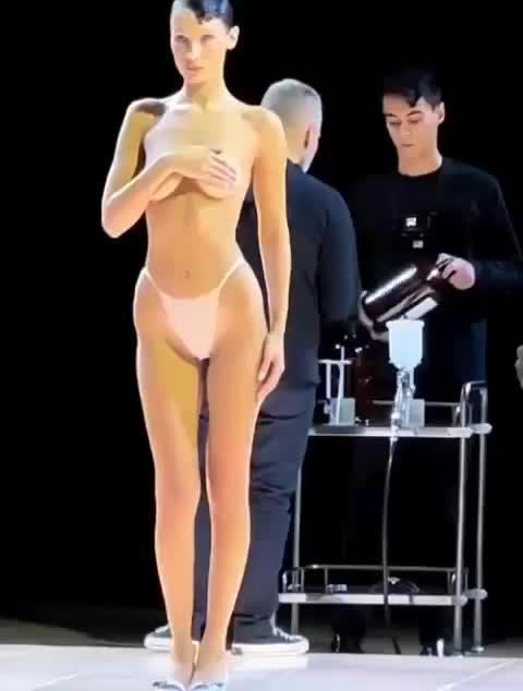 Bella Hadid Gets Dress Spray Painted on Half Nude Body