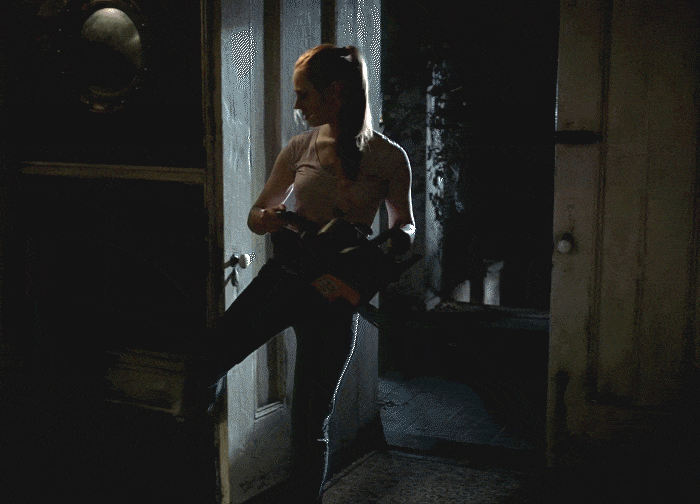 Deborah Ann Woll holding a chainsaw in True Blood