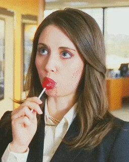 Alison Brie working a lollipop in Get A Job