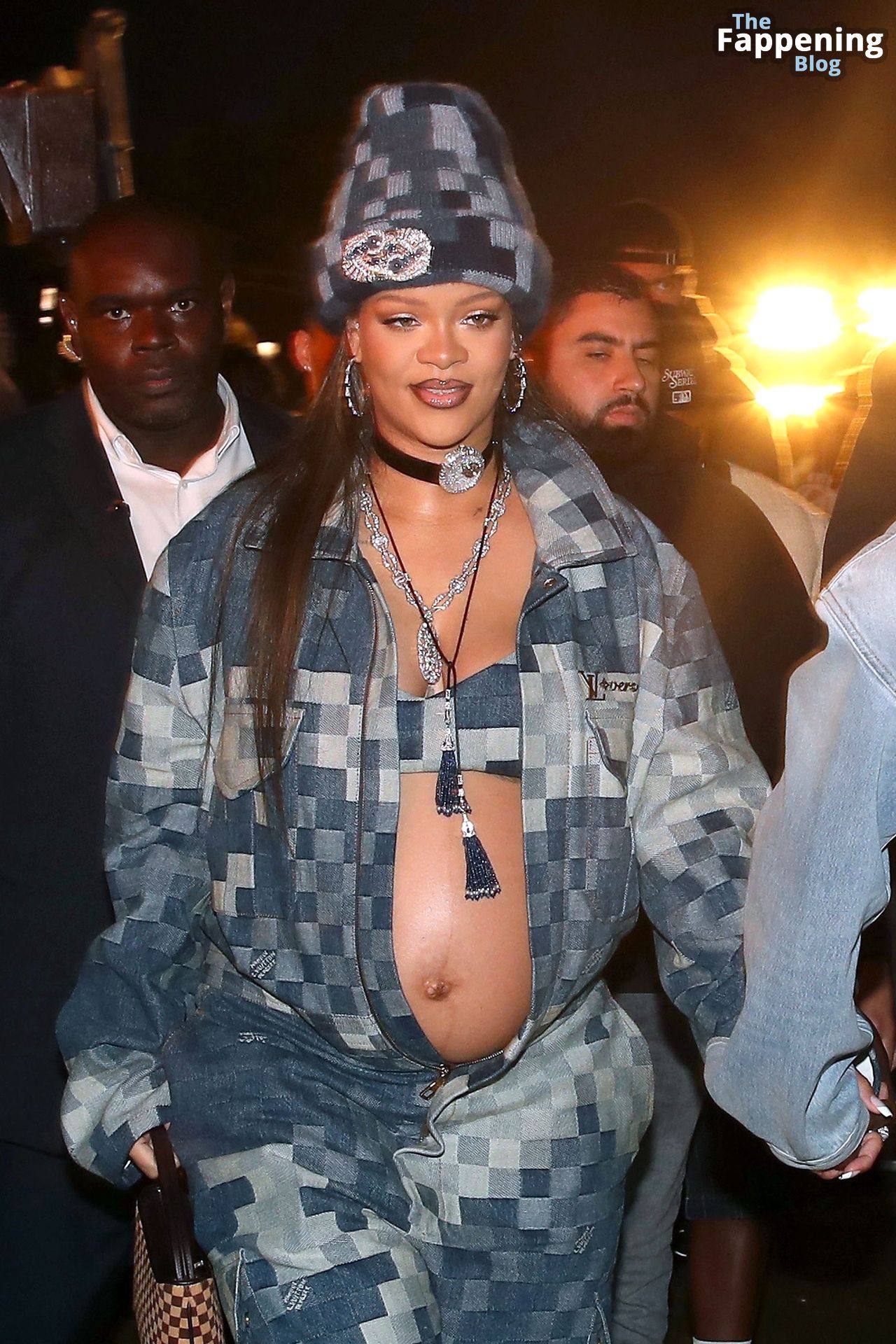 Rihanna Displays Her Baby Bump at the Louis Vuitton Menswear.jpg