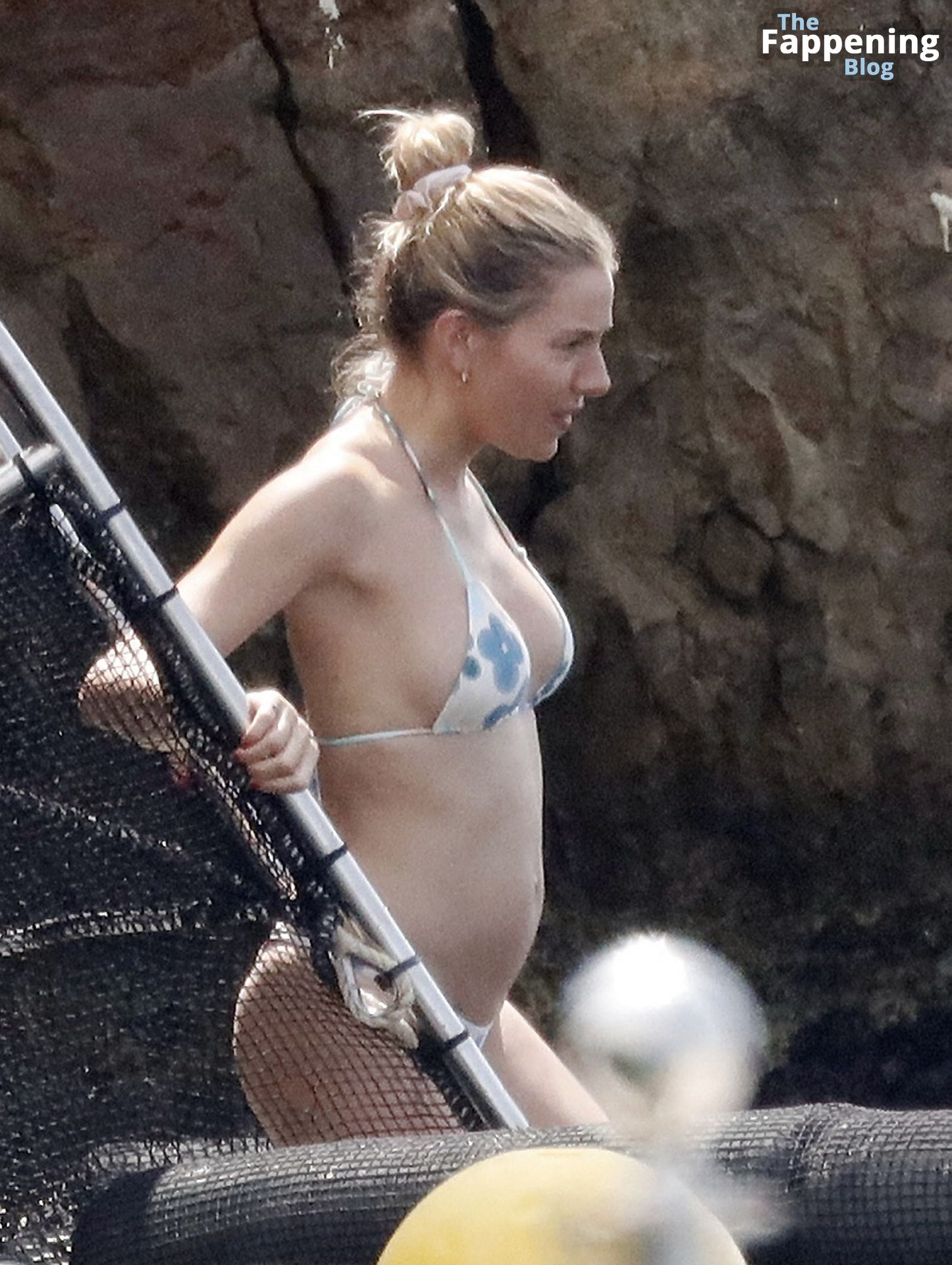 Sienna Miller is All Smiles as She Enjoys Her Vacation.jpg