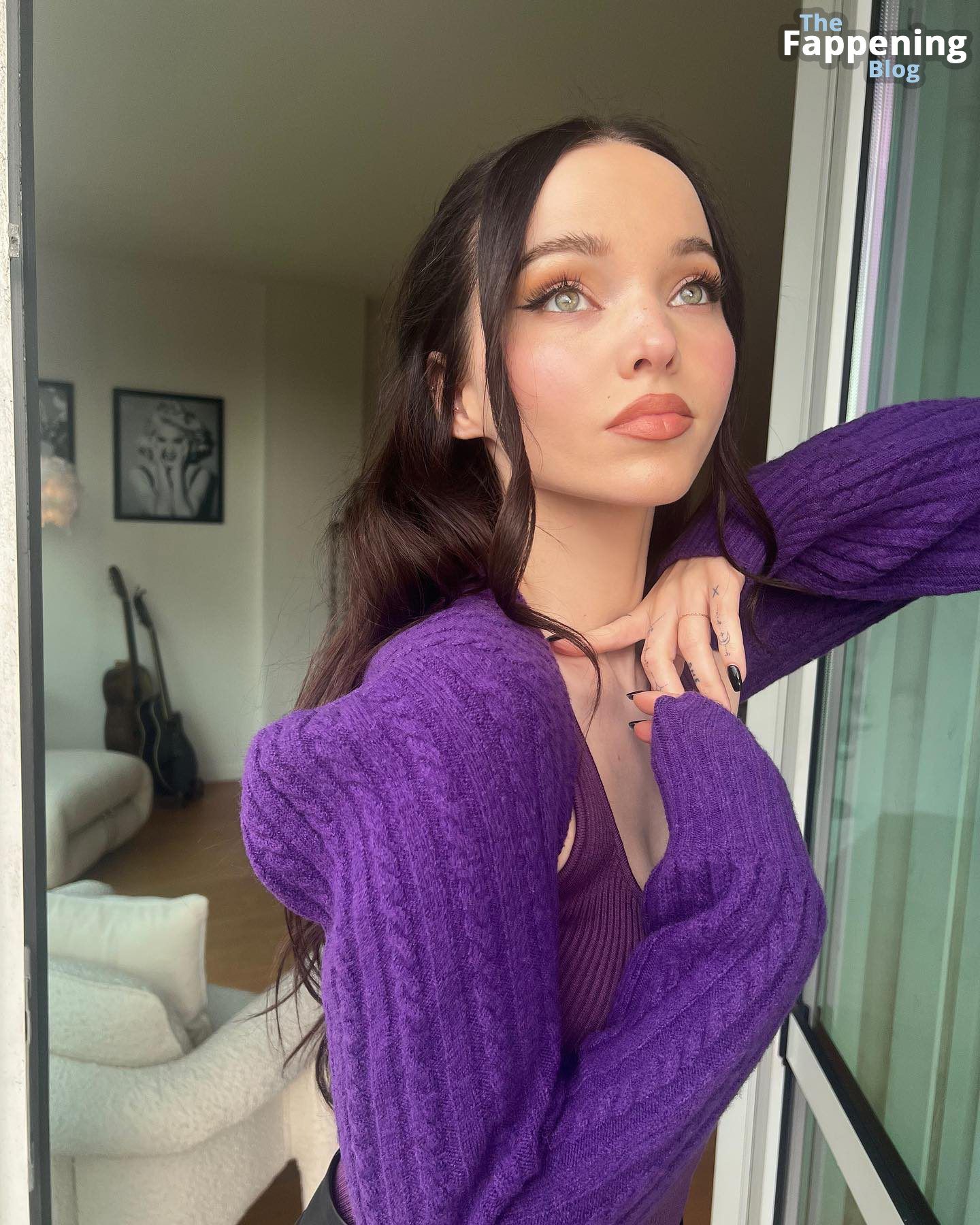 Dove Cameron Poses in a Purple Top for Her Followers.jpg